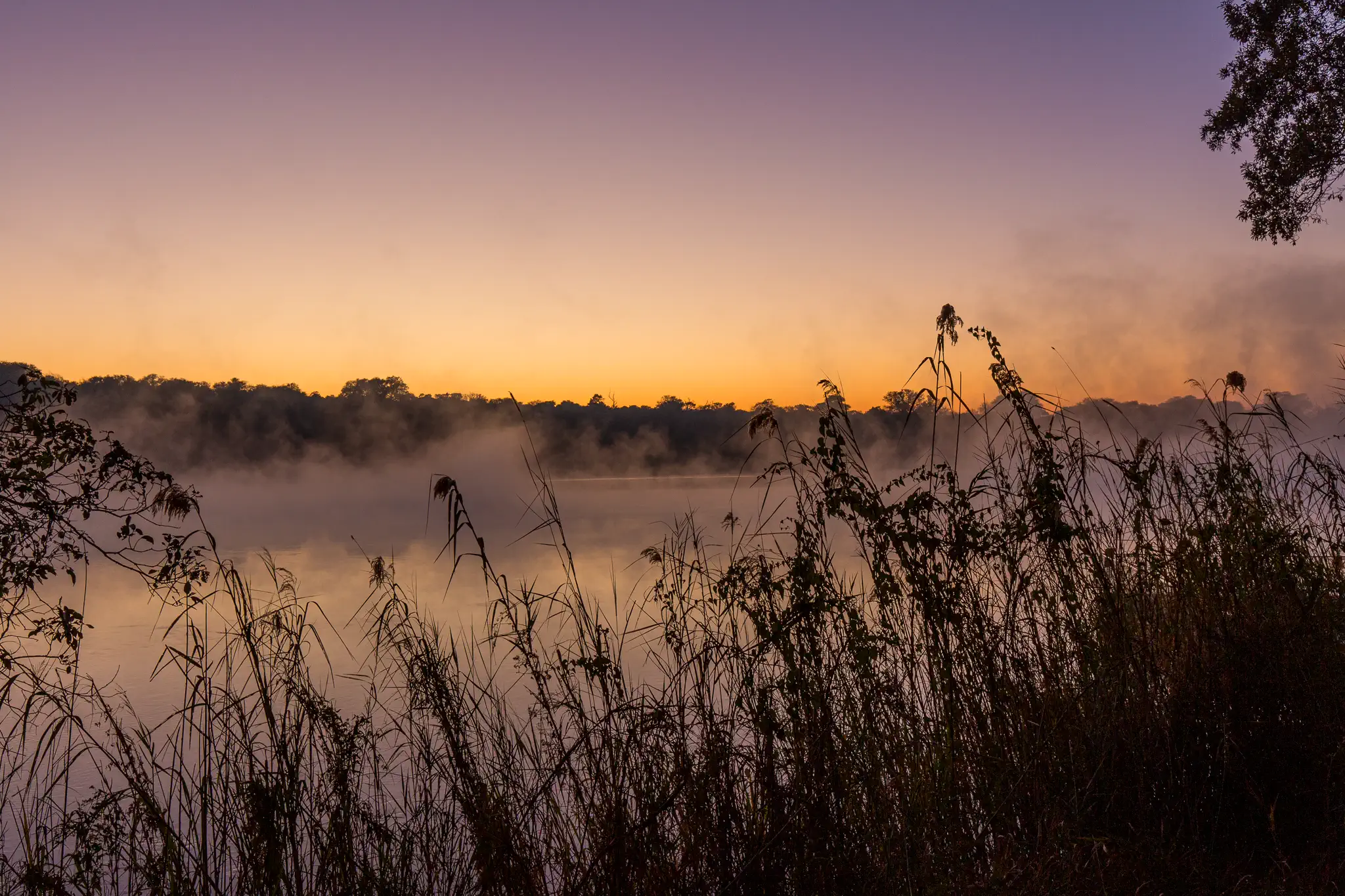 Sunrise over the Kavango river in the Zambezi region of Namibia